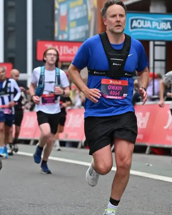 Owain running the AJ Bell Birmingham Half Marathon with his left Achilles strapped