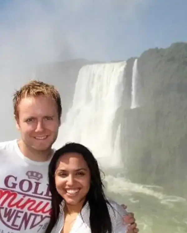 Owain and his wife in front of Iguazu Falls in Brazil