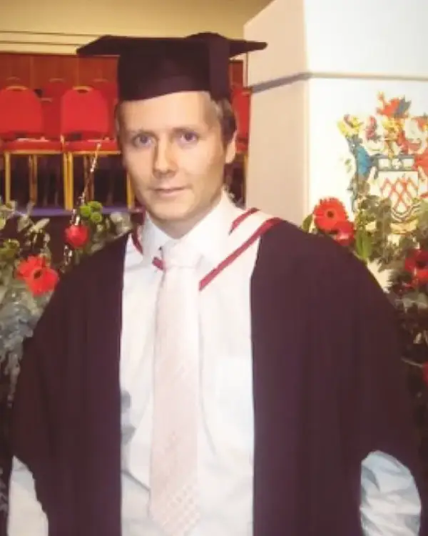 Owain in cap and gown at his 2008 University of Gloucestershire graduation ceremony