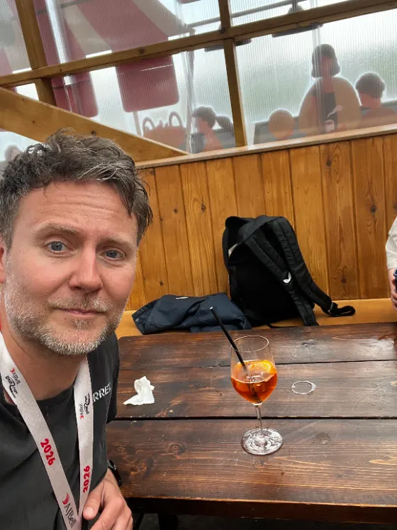 Owain Powell relaxing with a drink after the half marathon